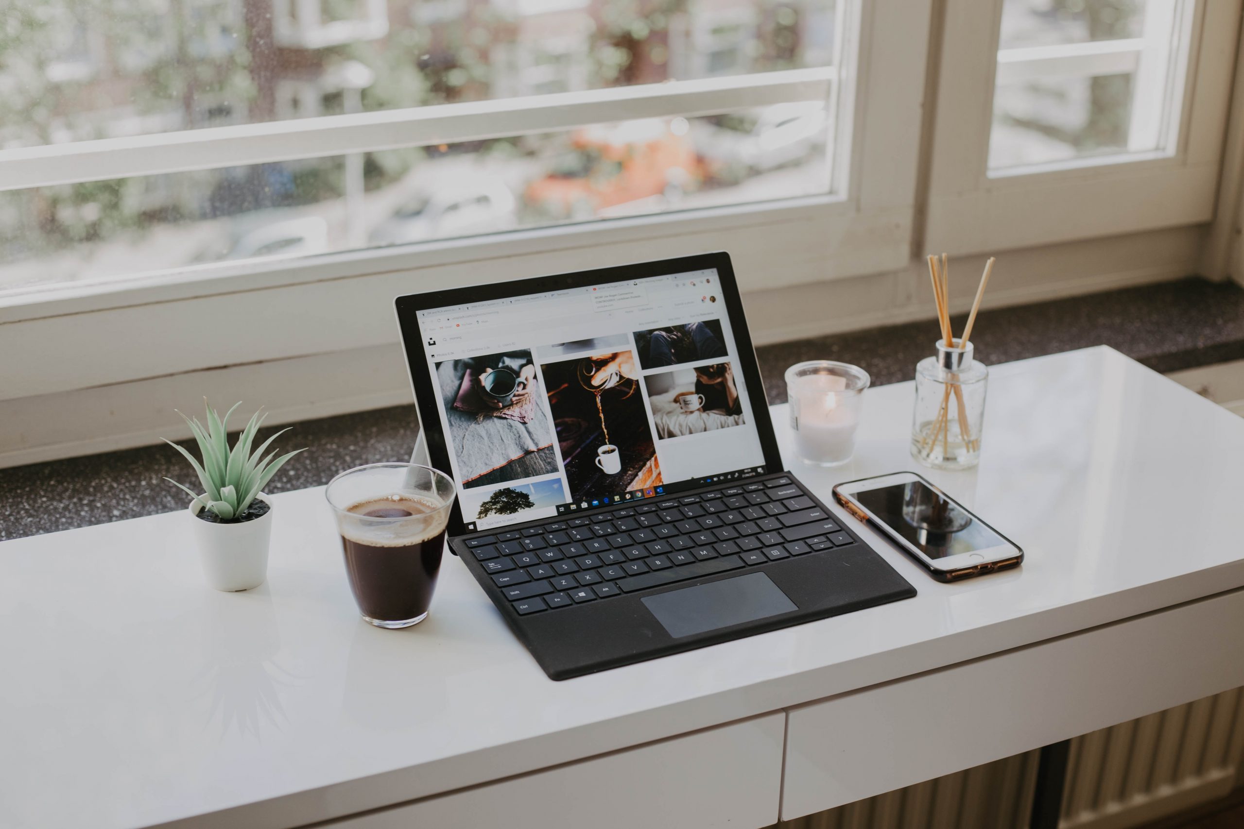 macbook pro on white table